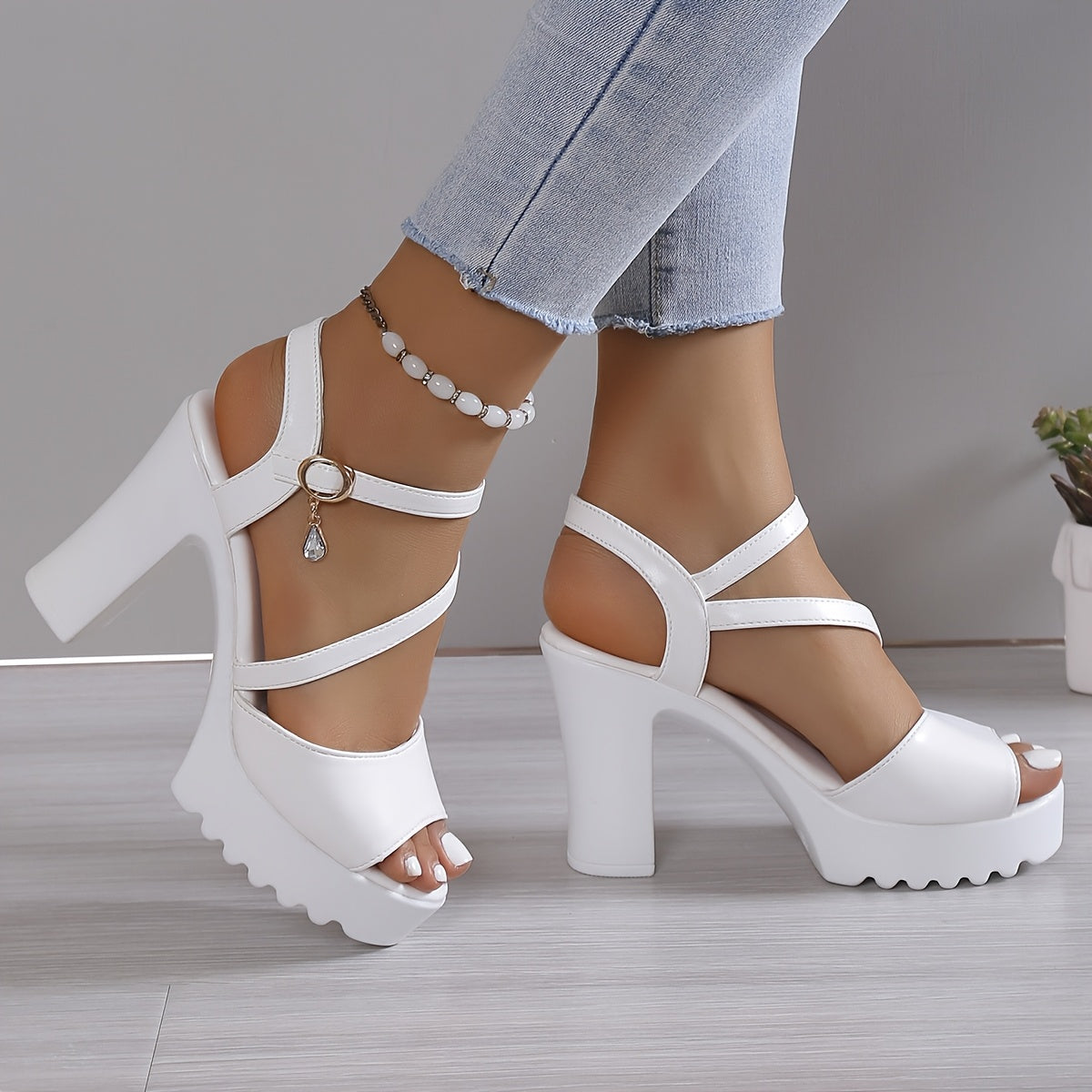 White platform sandals worn with light blue jeans on a neutral background - NoraLouise